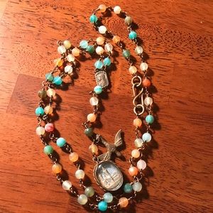 Rosary style necklace.